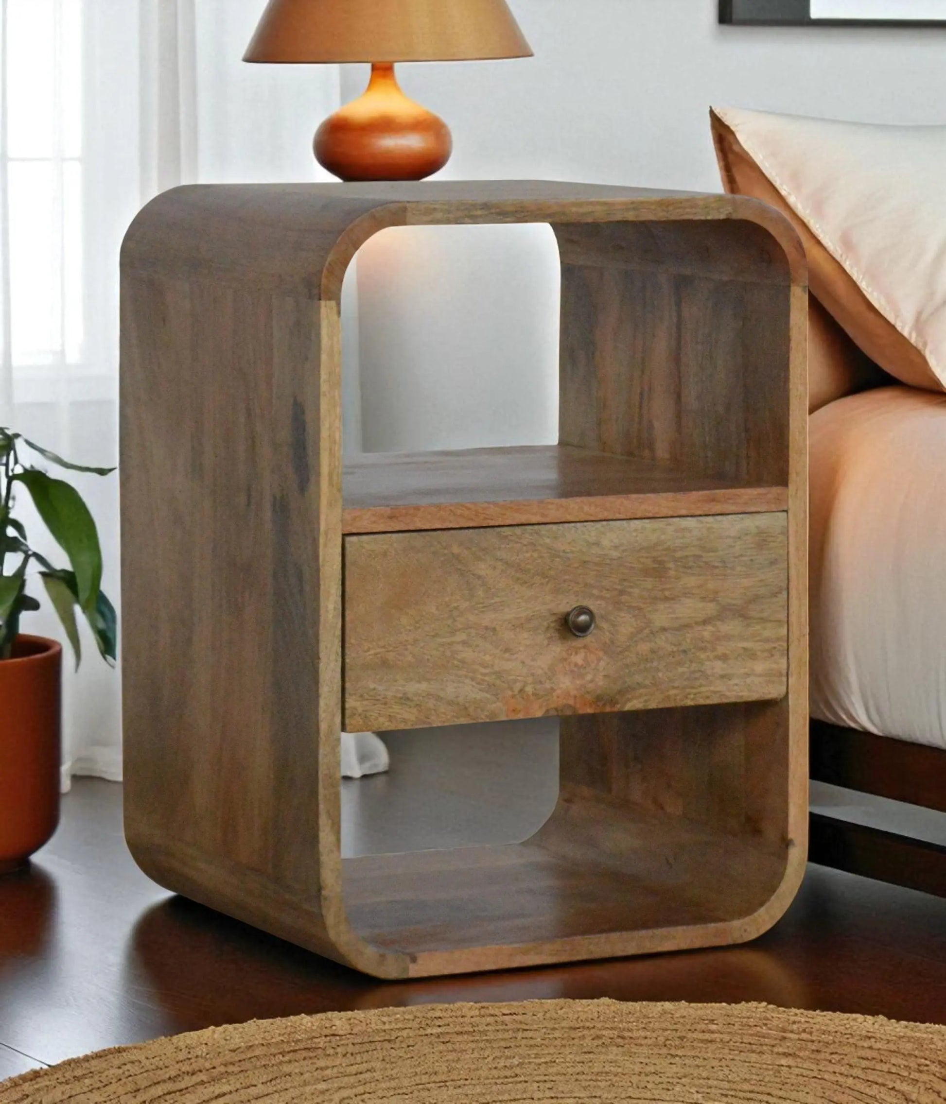 Wooden nightstand with a drawer in a bedroom setting