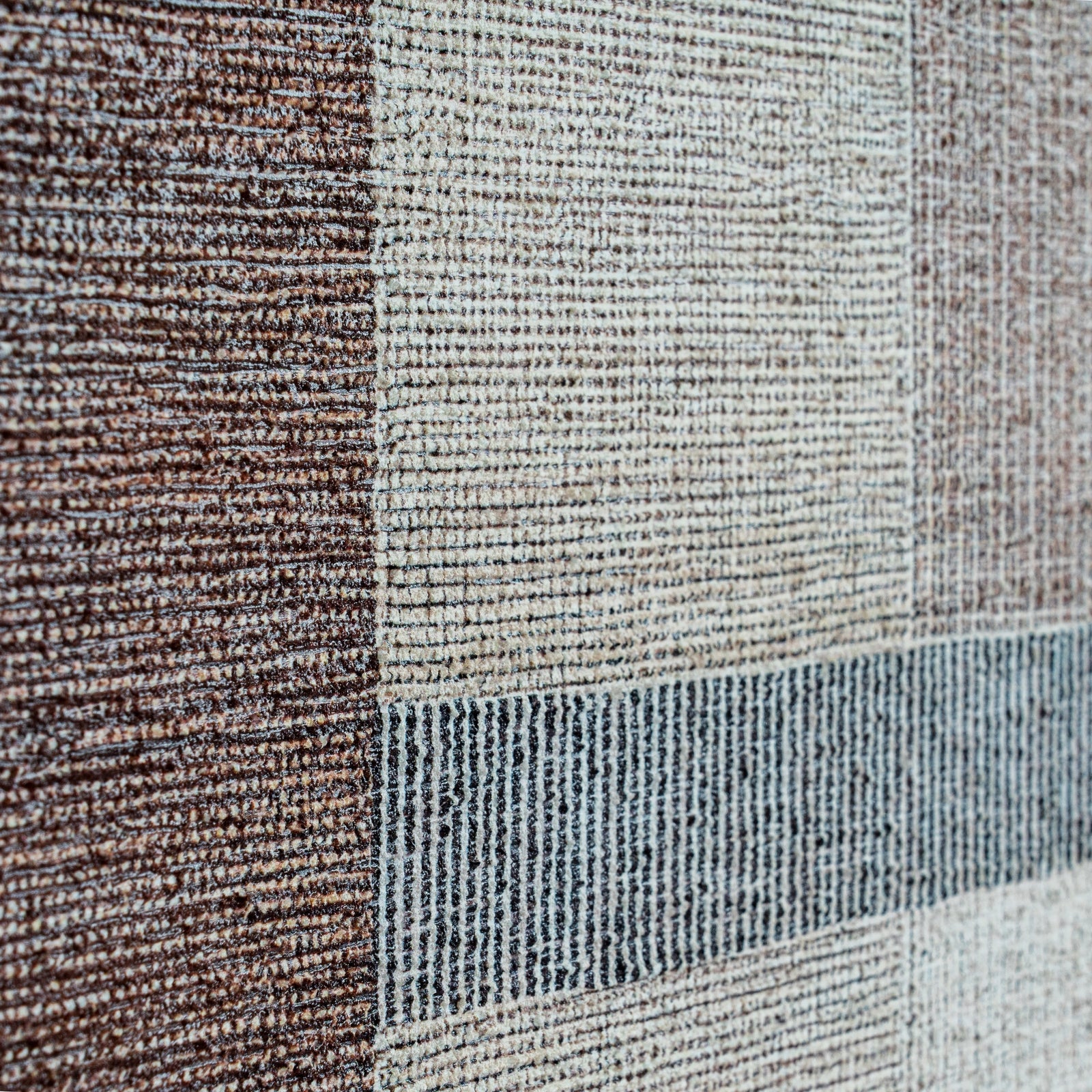 Close-up of a textured fabric with brown, beige, and blue stripes.
