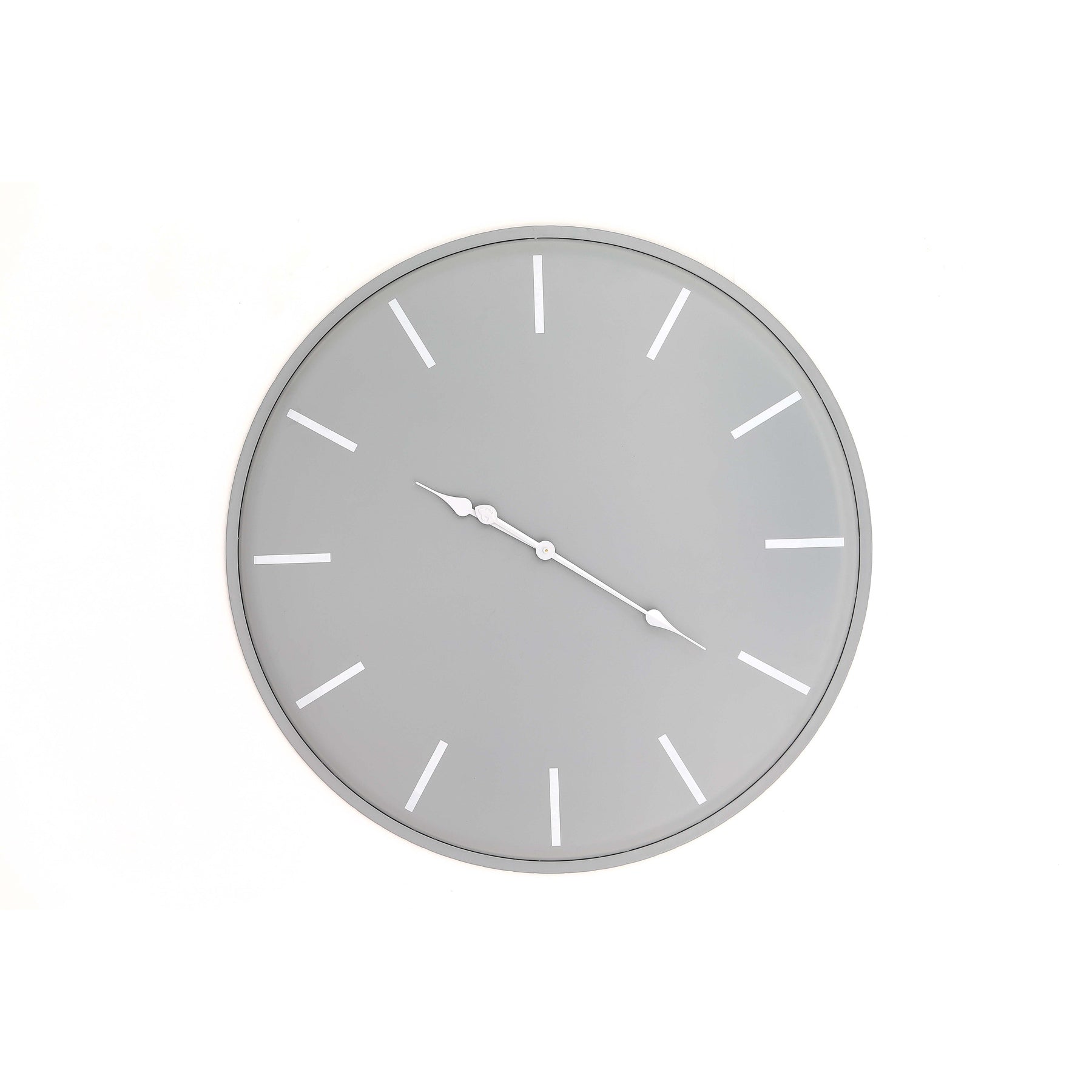 Round wall clock with gray face and white hour markers on a white background