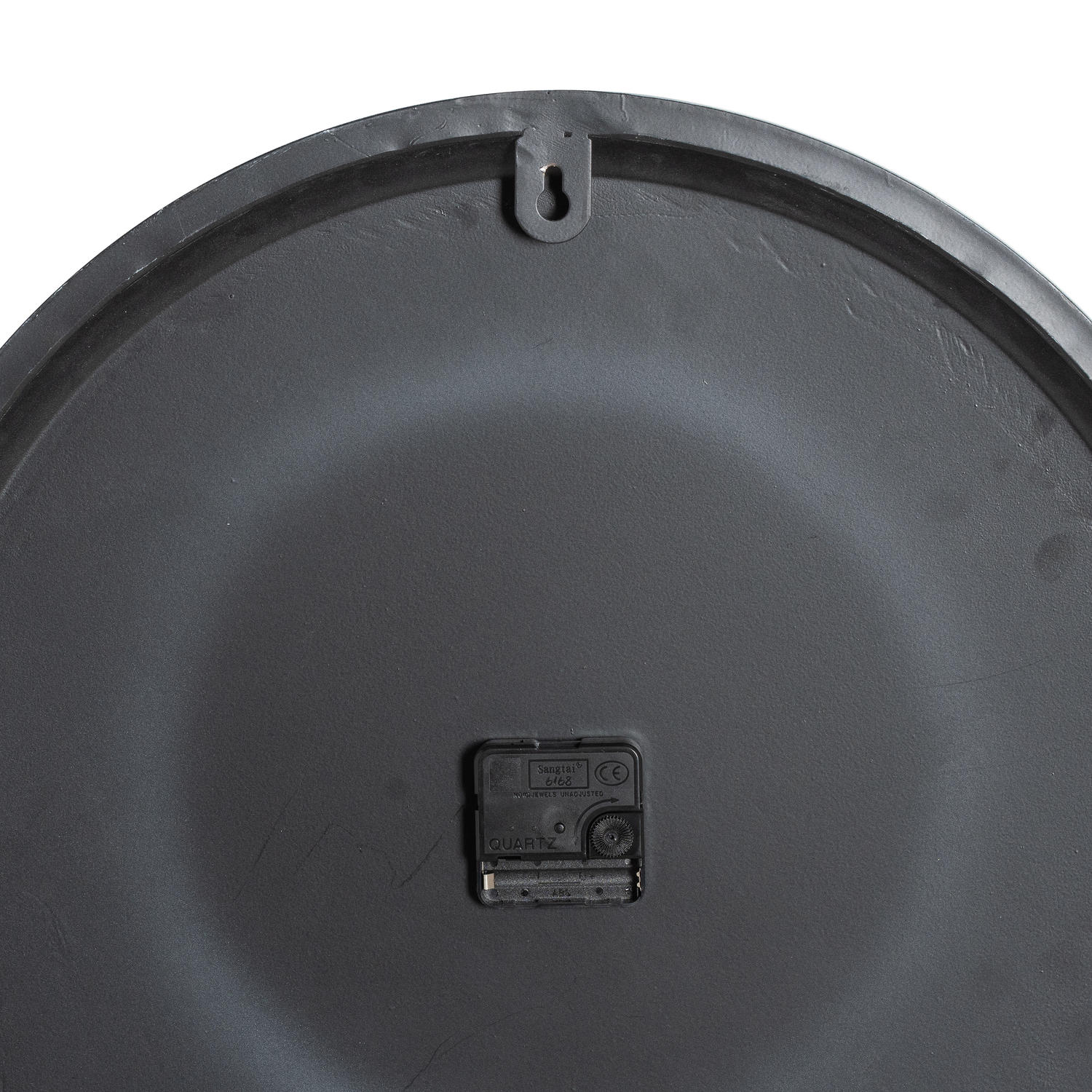 Close-up of a black plastic component on a white background