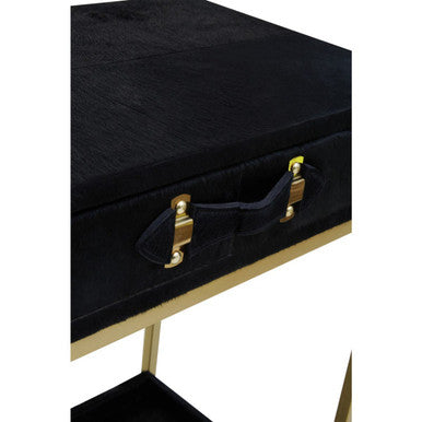 Black suitcase with gold accents on a white background