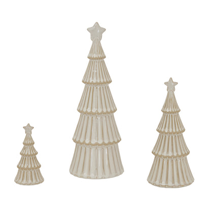 Set of three ceramic Christmas trees with star toppers on a white background