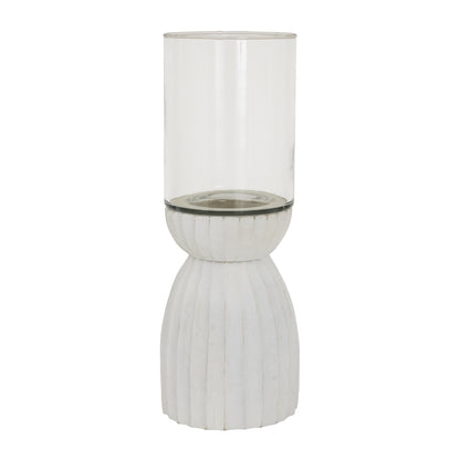 Tall glass vase with ribbed white base on a white background