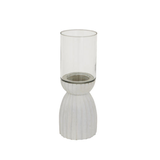 Decorative candle holder with ribbed base and clear glass on a white background