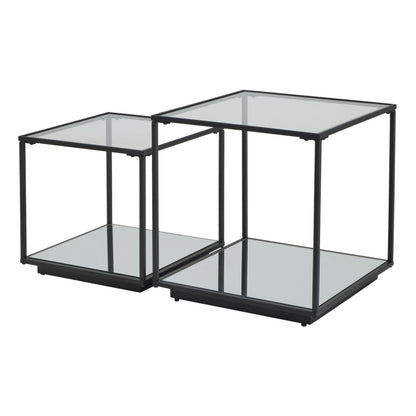Set of two glass side tables with black metal frames on a white background