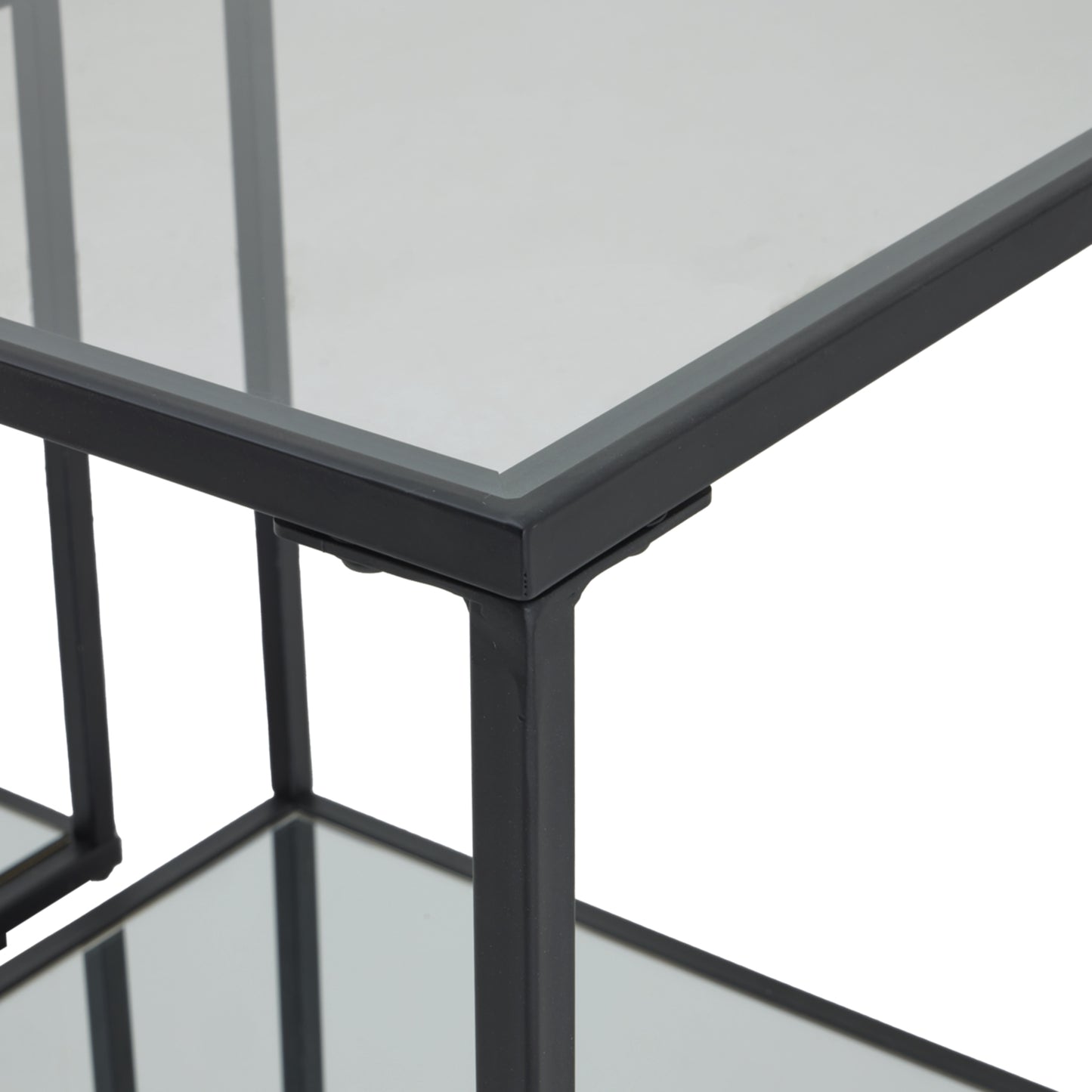 Glass table with black metal frame on a white background