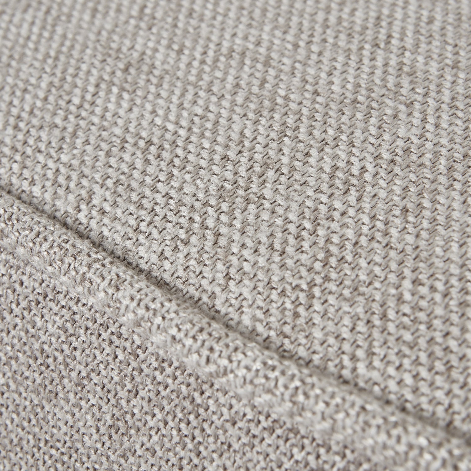 Close-up of beige fabric texture with a diagonal line