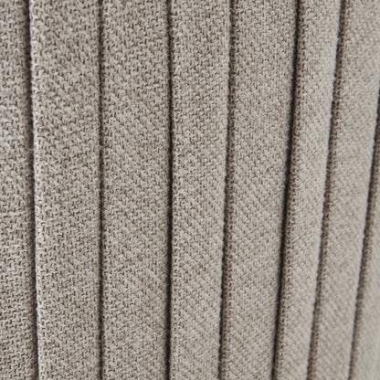 Close-up of textured beige fabric with a ribbed pattern
