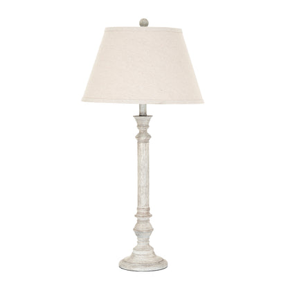 Table lamp with a white shade on a white background
