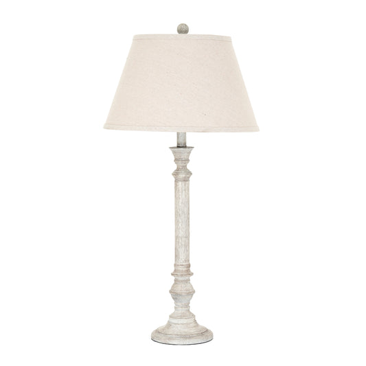 Table lamp with a white shade on a white background