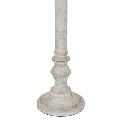 Decorative pedestal with a rustic finish on a white background