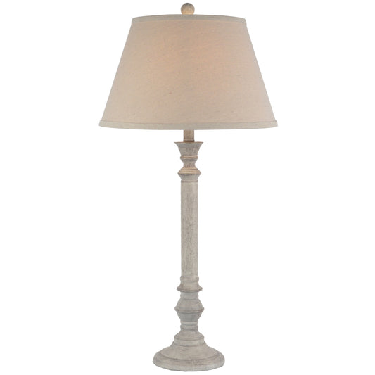 Table lamp with beige shade on a white background