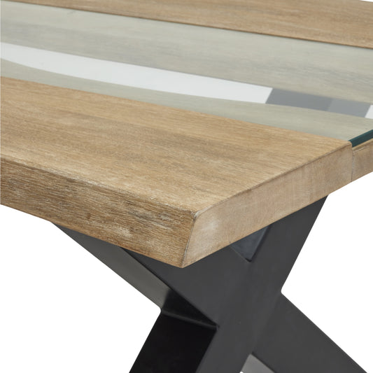Wooden table with a striped pattern on top and black metal legs.