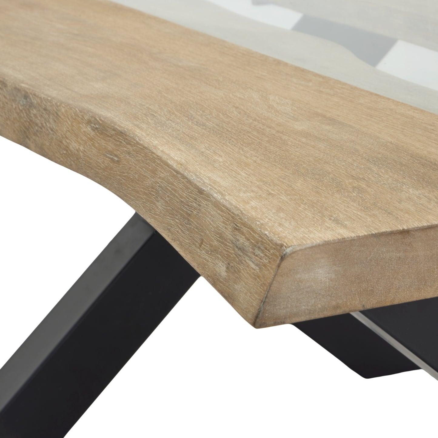 Close-up of a wooden table with a black metal leg on a white background