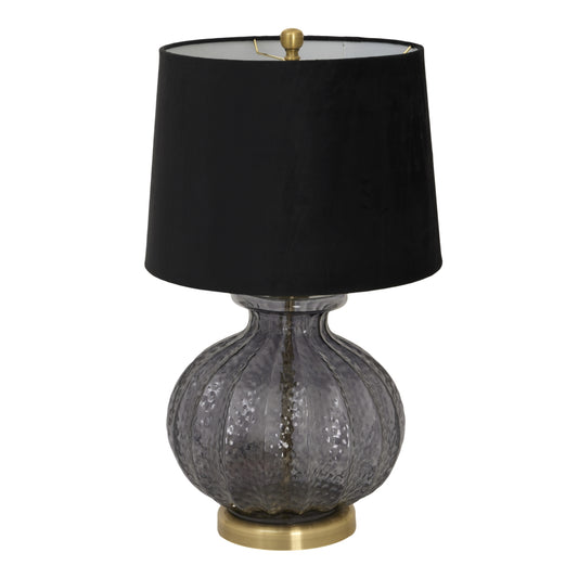 Table lamp with black shade and textured glass base on a white background