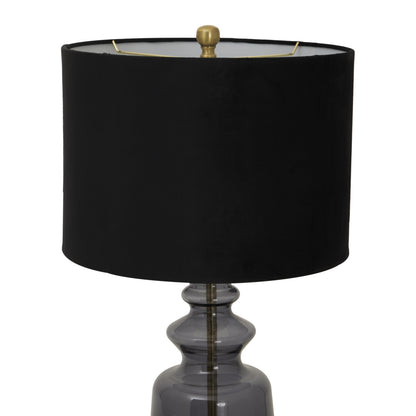 Black lamp with a dark glass base on a white background