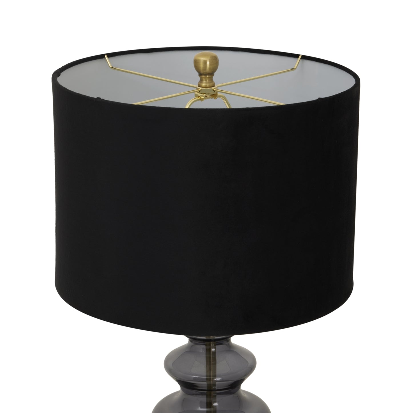 Black lamp with a gold fixture on a white background