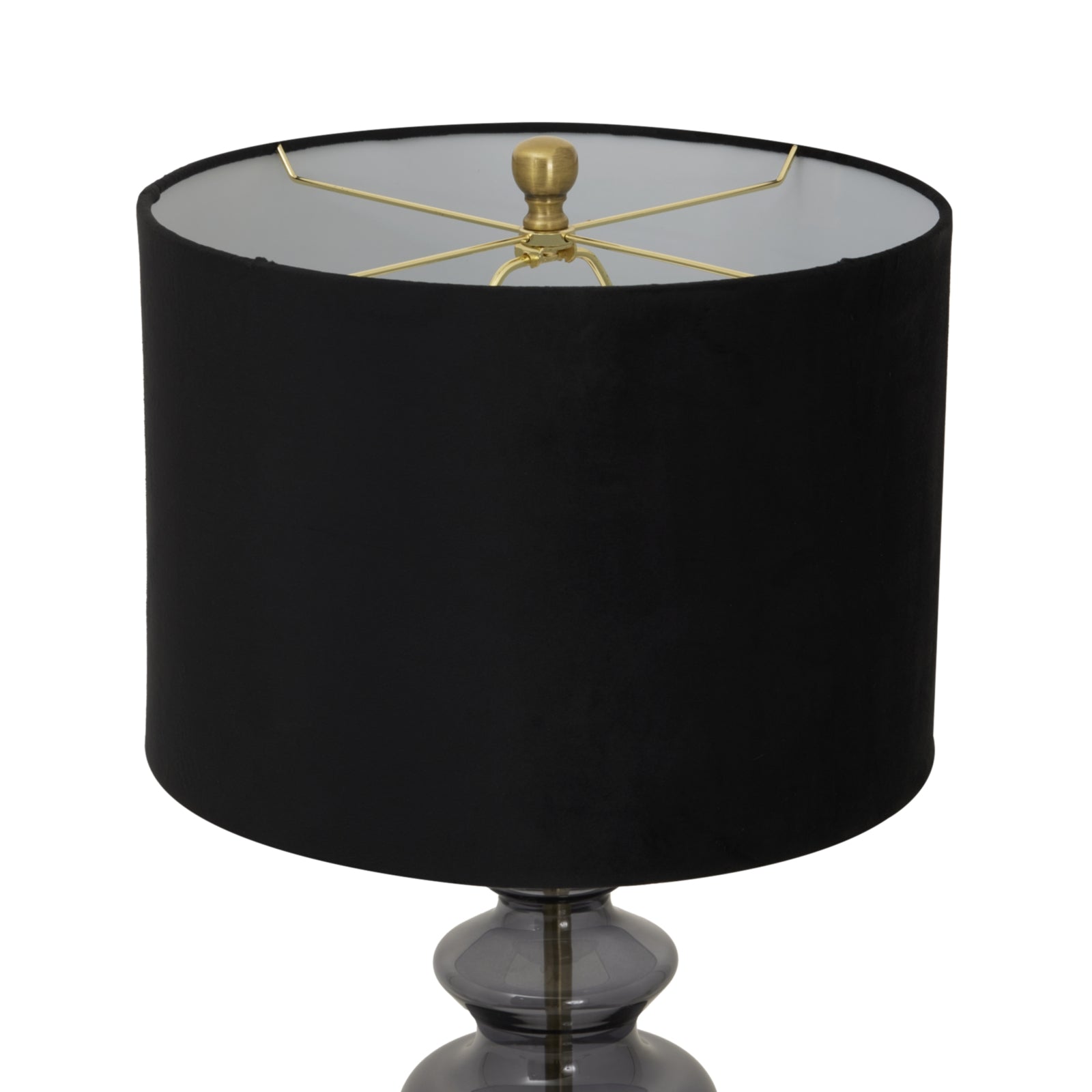 Black lamp with a gold fixture on a white background