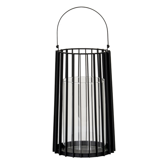 Black metal lantern with glass insert on a white background