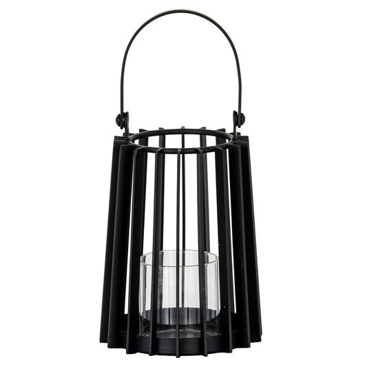 Black metal lantern with glass insert on a white background