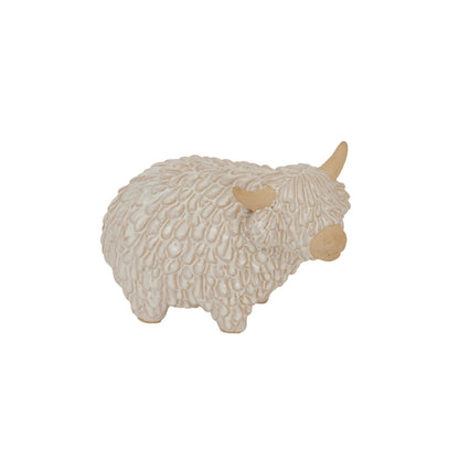 Decorative sheep figurine with textured wool on a white background