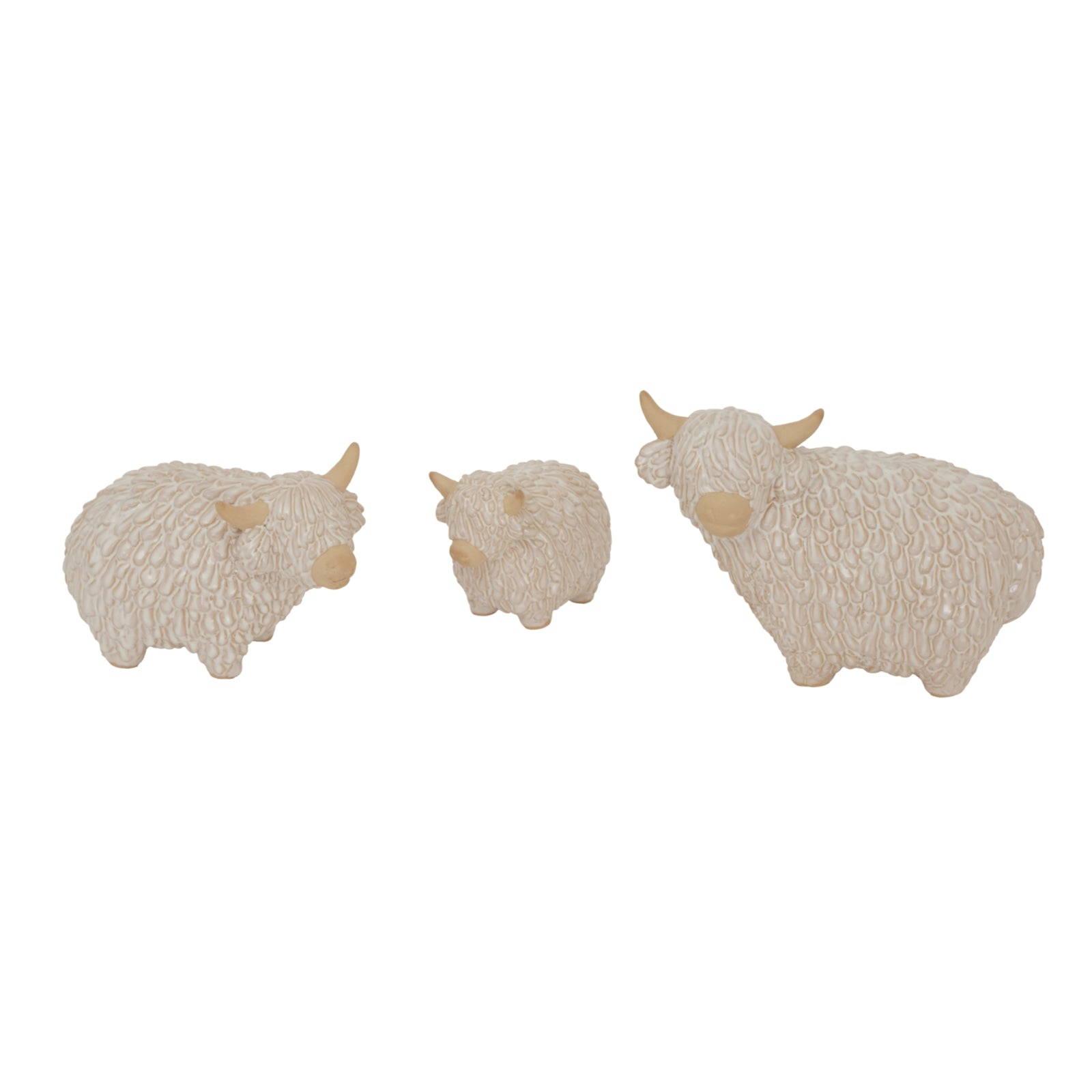 Three small beige sheep figurines on a white background