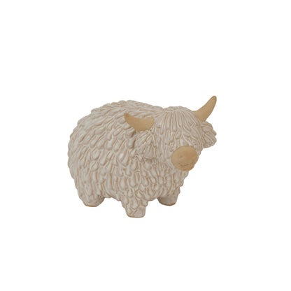 Decorative sheep figurine with beige wool on a white background