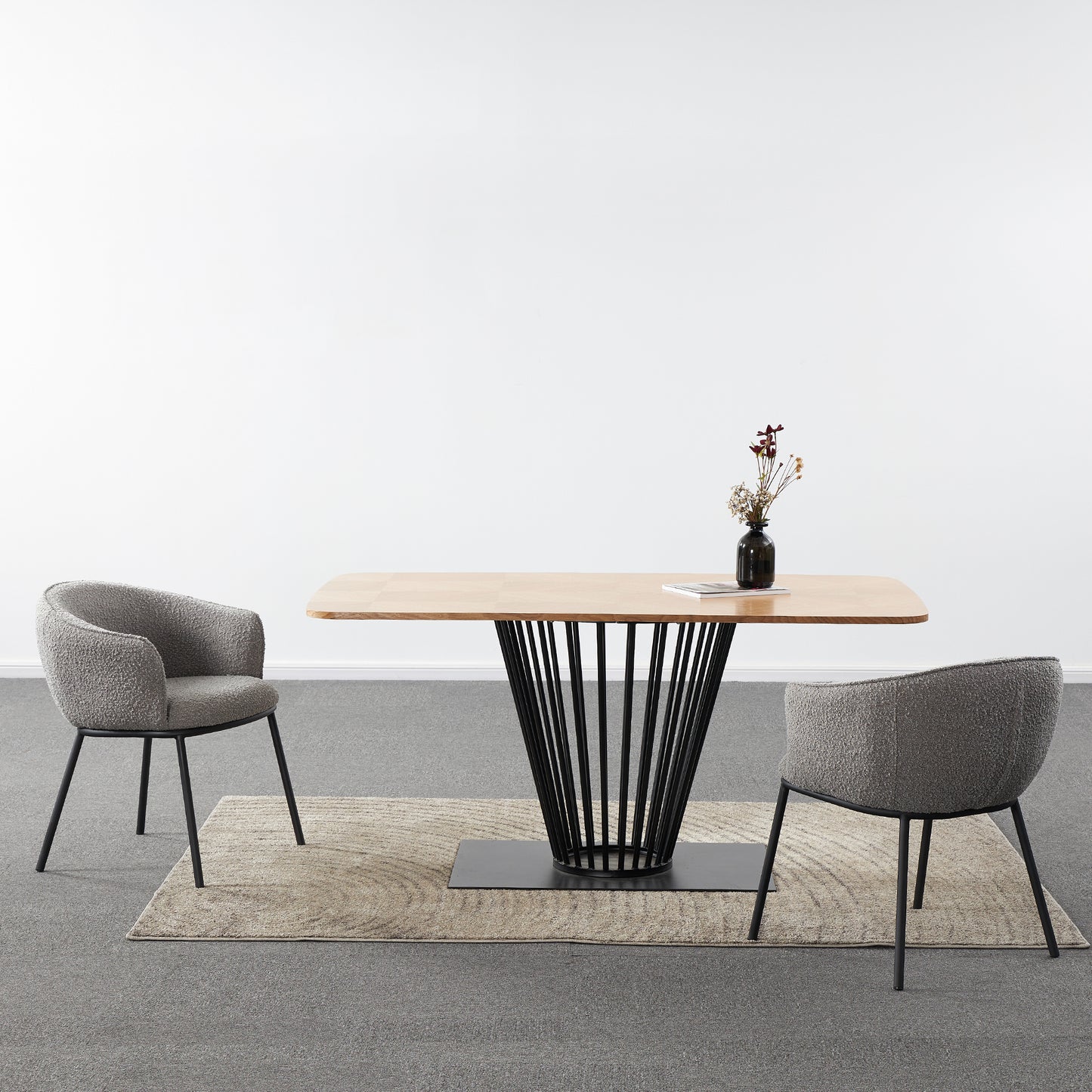 Dining table with two chairs on a gray floor and white wall background