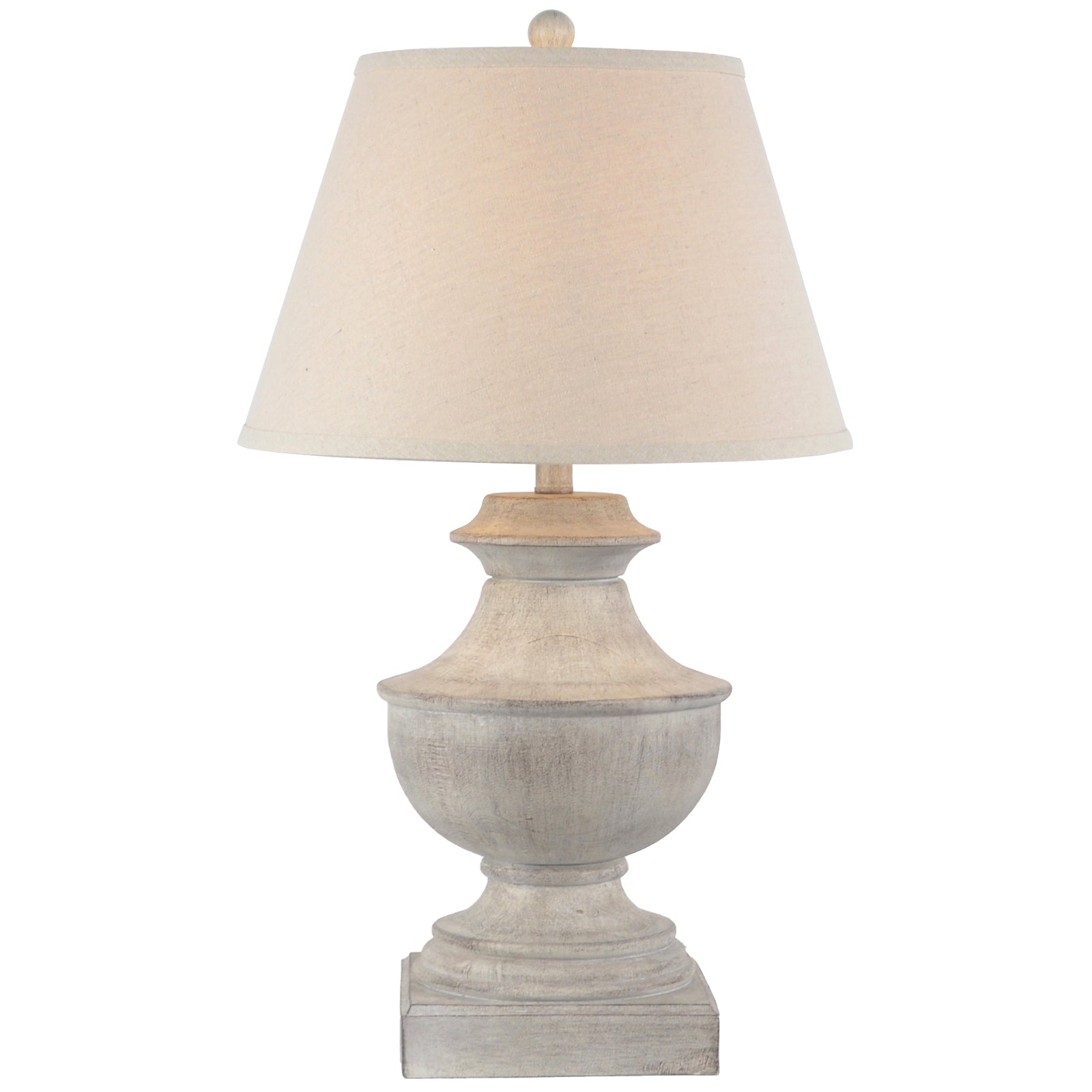 Table lamp with a beige shade and textured base on a white background