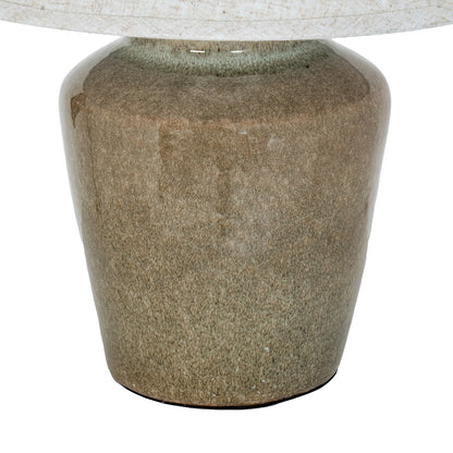 Close-up of a textured stone table base on a white background