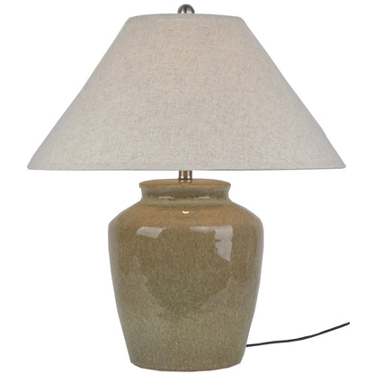 Table lamp with beige ceramic base and linen shade on a white background