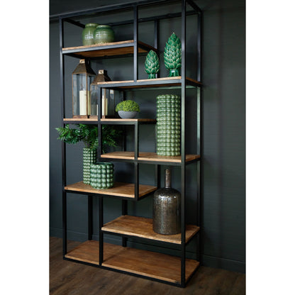 Bookshelf with wooden shelves and decorative items against a dark wall