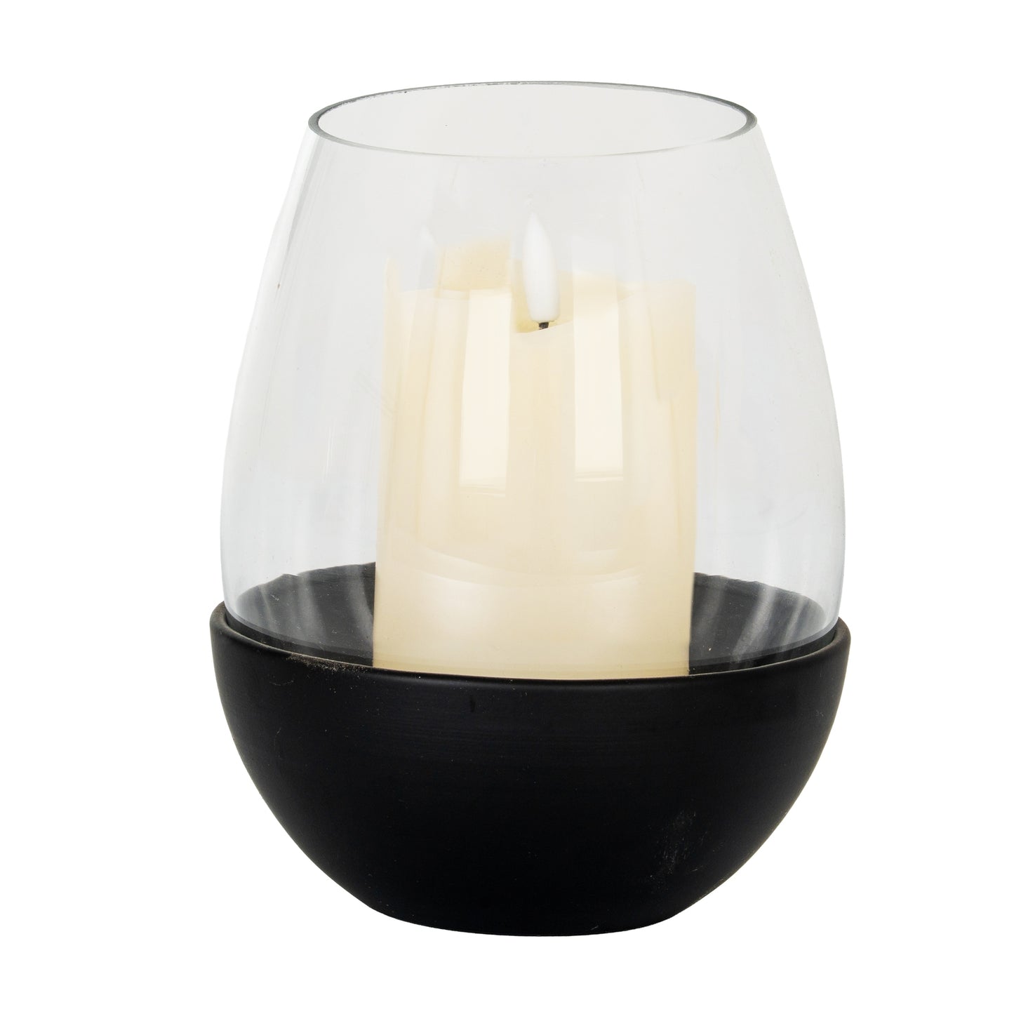 Clear glass candle holder with a black base containing a white candle on a white background