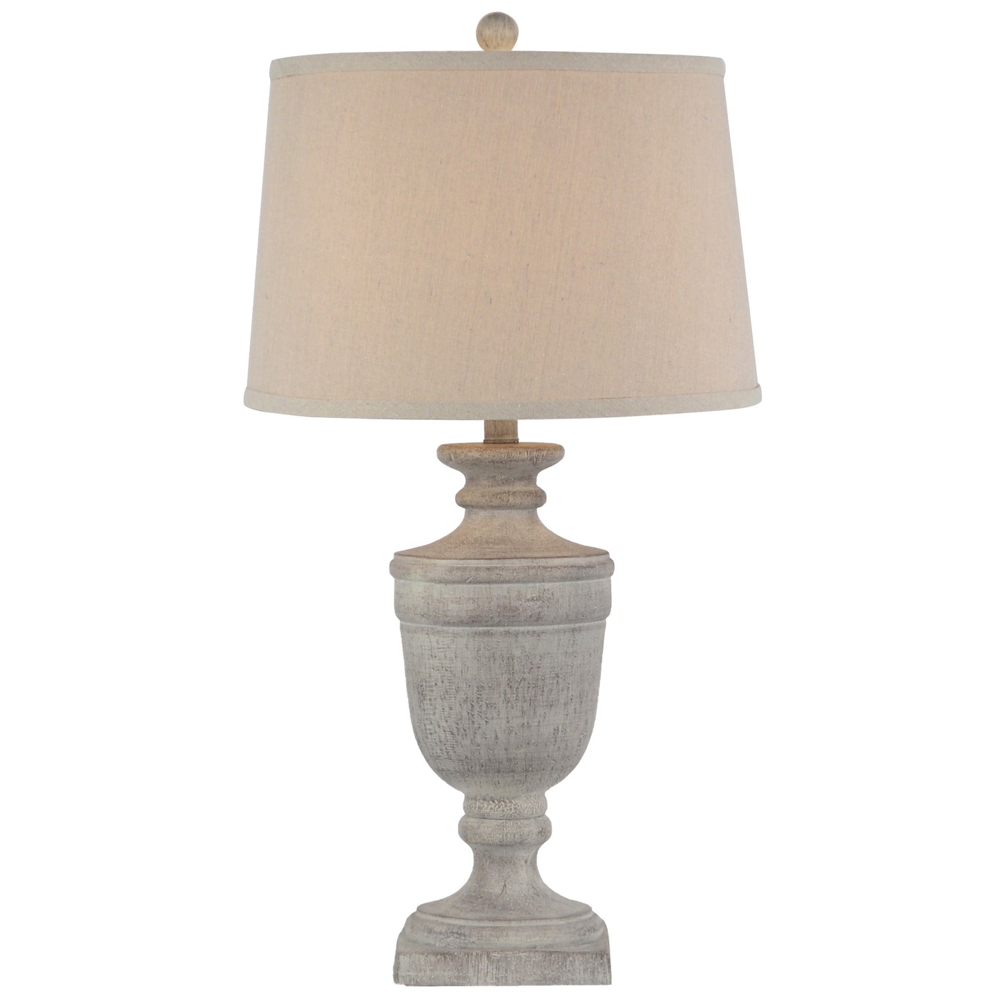 Table lamp with a textured base and beige lampshade on a white background