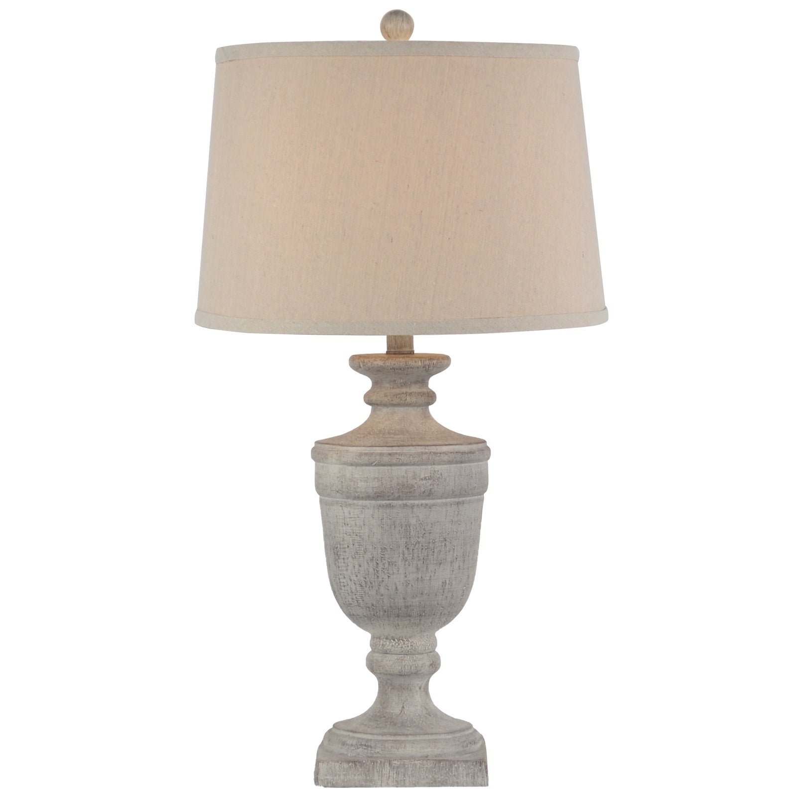 Table lamp with a textured base and beige lampshade on a white background