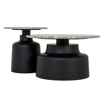 Two round tables with marble tops and black cylindrical bases on a white background