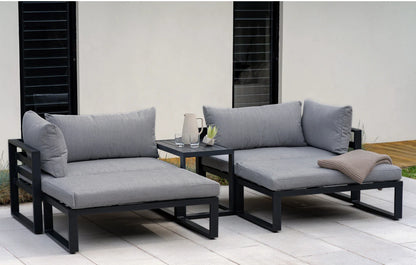 Outdoor patio furniture set with gray cushions on a wooden deck.