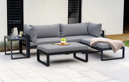Outdoor patio set with gray cushions on a patio
