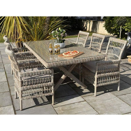 Outdoor patio set with table and chairs on a paved patio