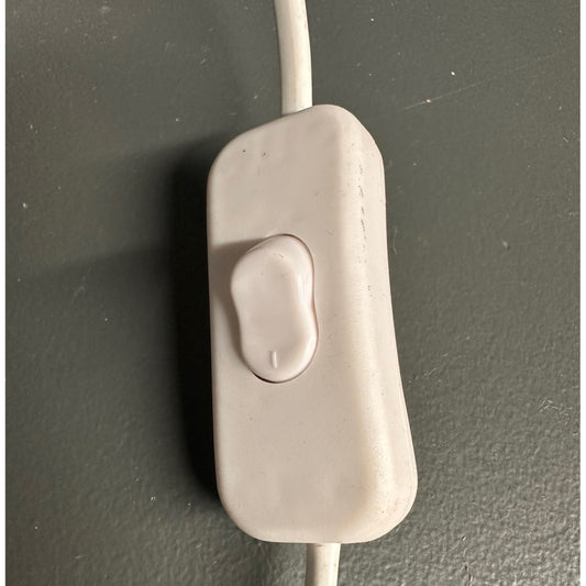 Beige electronic component on a dark gray background