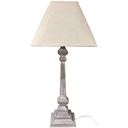 Table lamp with beige shade and wooden base on a white background