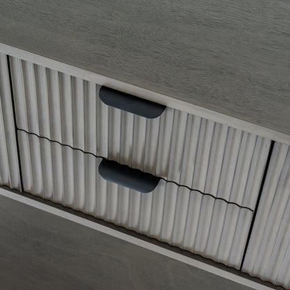 Close-up of a textured surface with ribbed pattern and black handles.