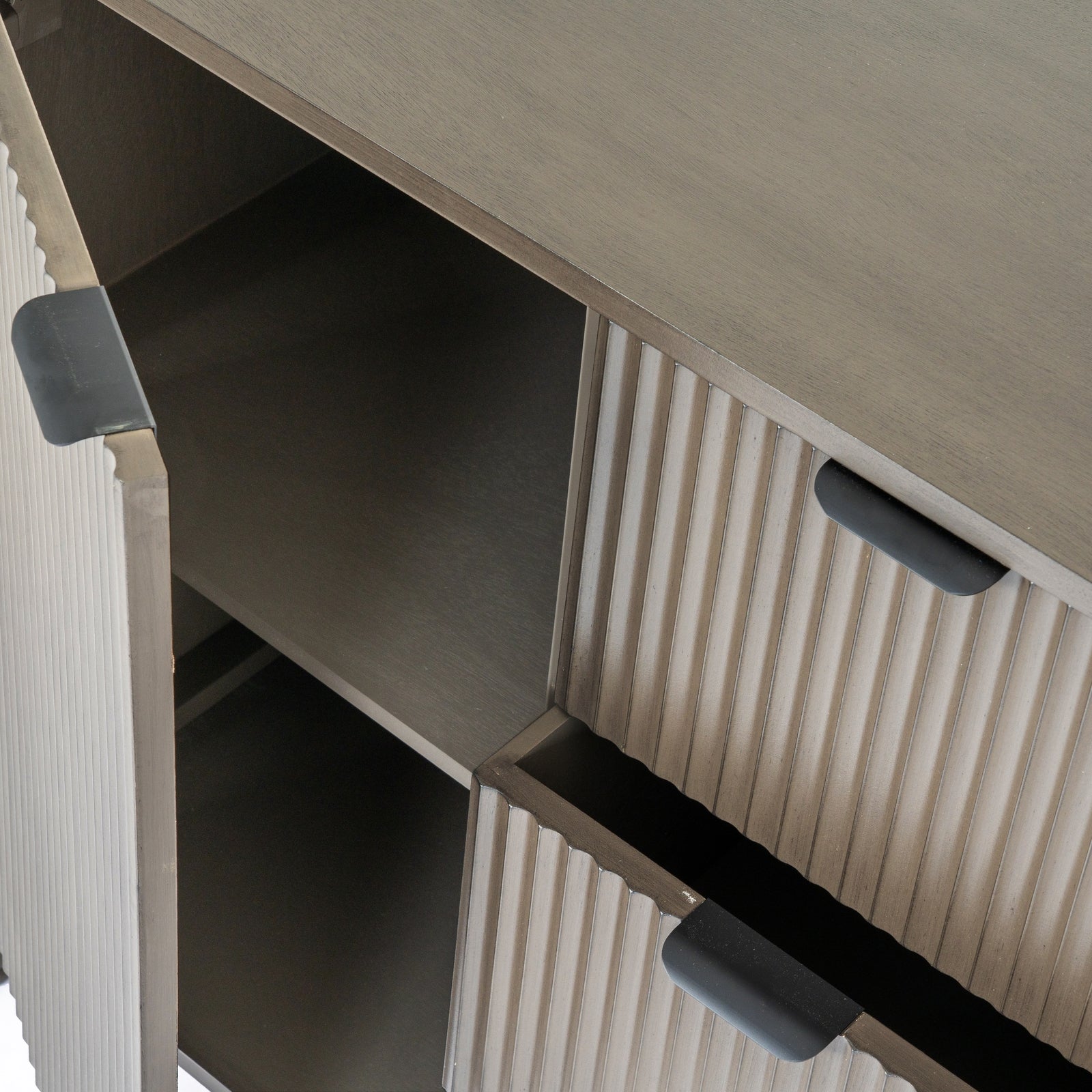 Close-up of a cabinet with open doors showing a ribbed texture.
