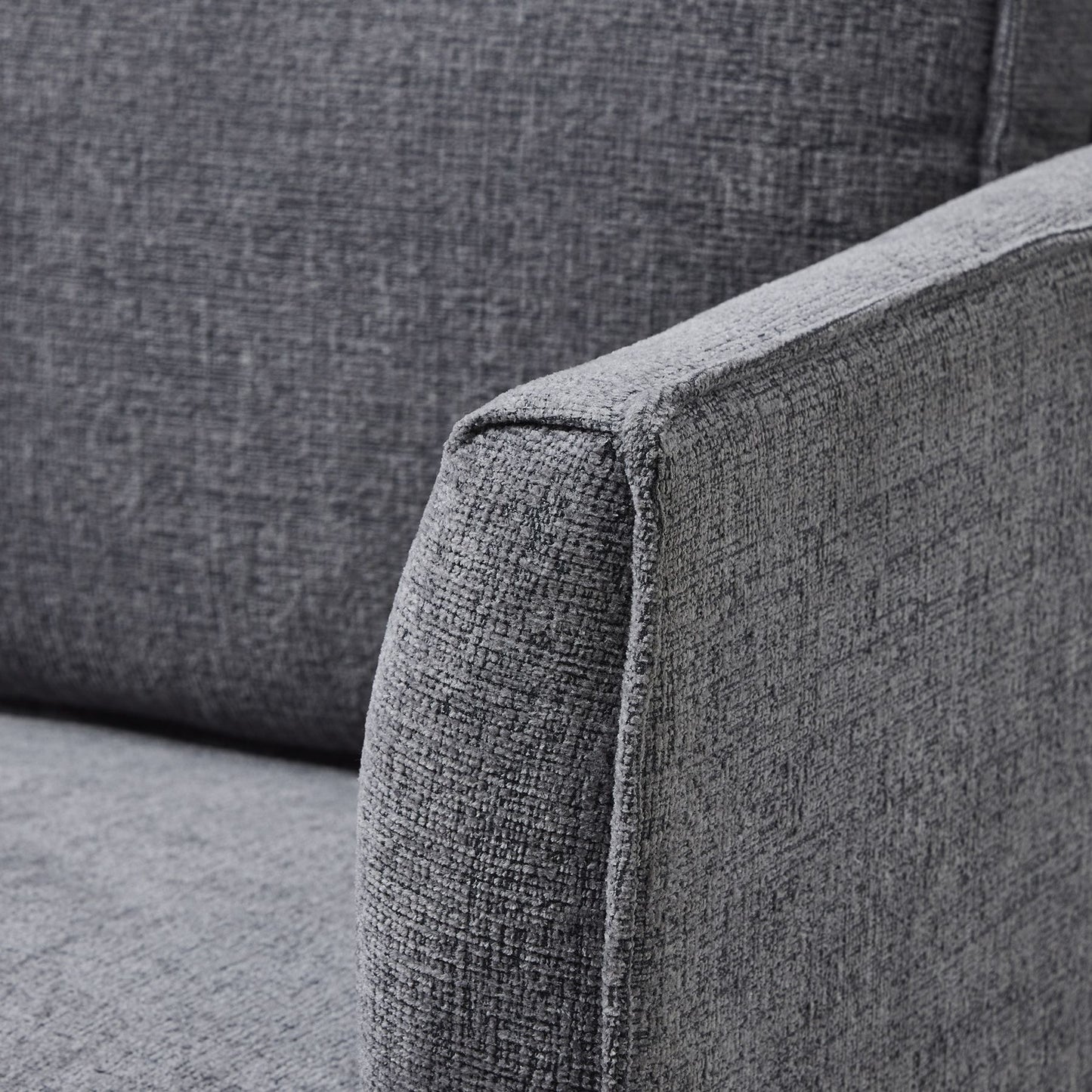 Gray fabric sofa corner with a textured pattern
