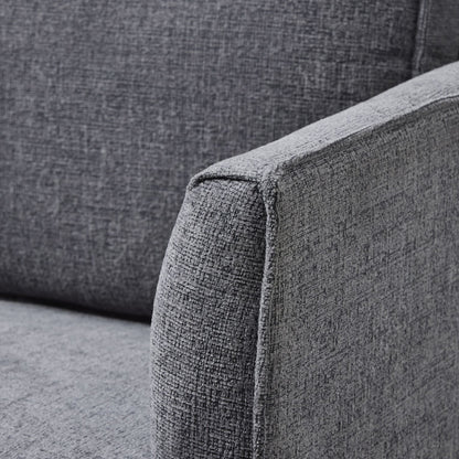 Gray fabric sofa corner with a textured pattern
