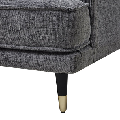 Gray upholstered chair with black and gold legs on a white background