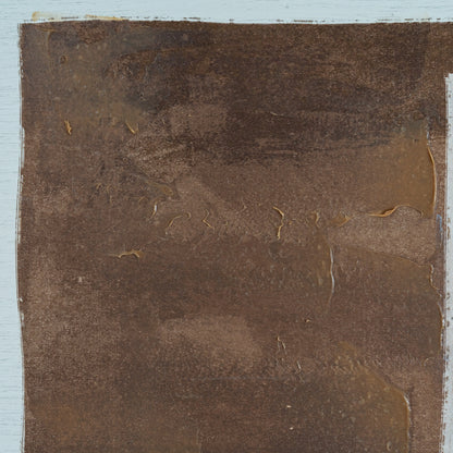 Brown textured surface with a light blue border