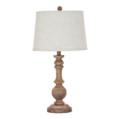 Table lamp with wooden base and beige lampshade on a white background