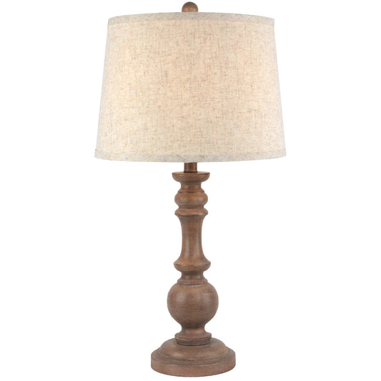 Table lamp with wooden base and beige fabric shade on a white background