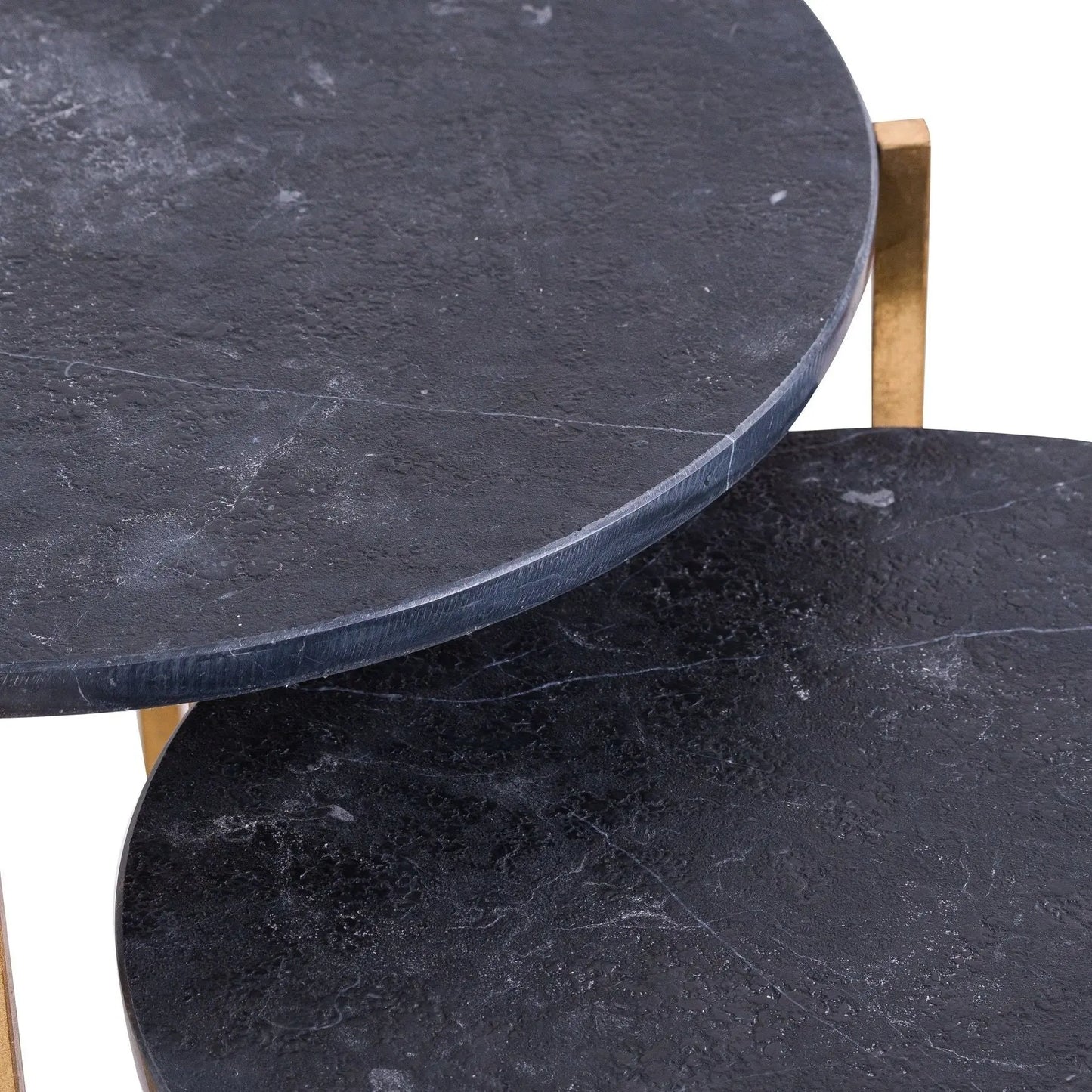 Two round marble tables with a dark gray surface on a white background